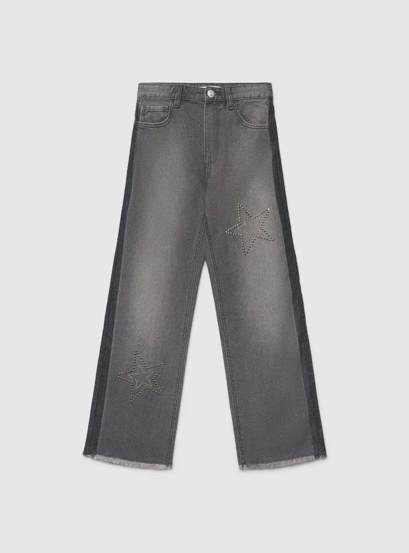 Jeans wide leg con stelle di borchie