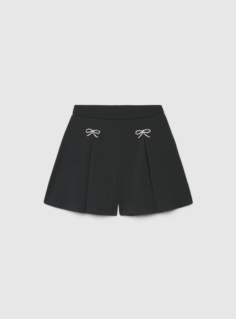 Shorts con fiocchi strass
