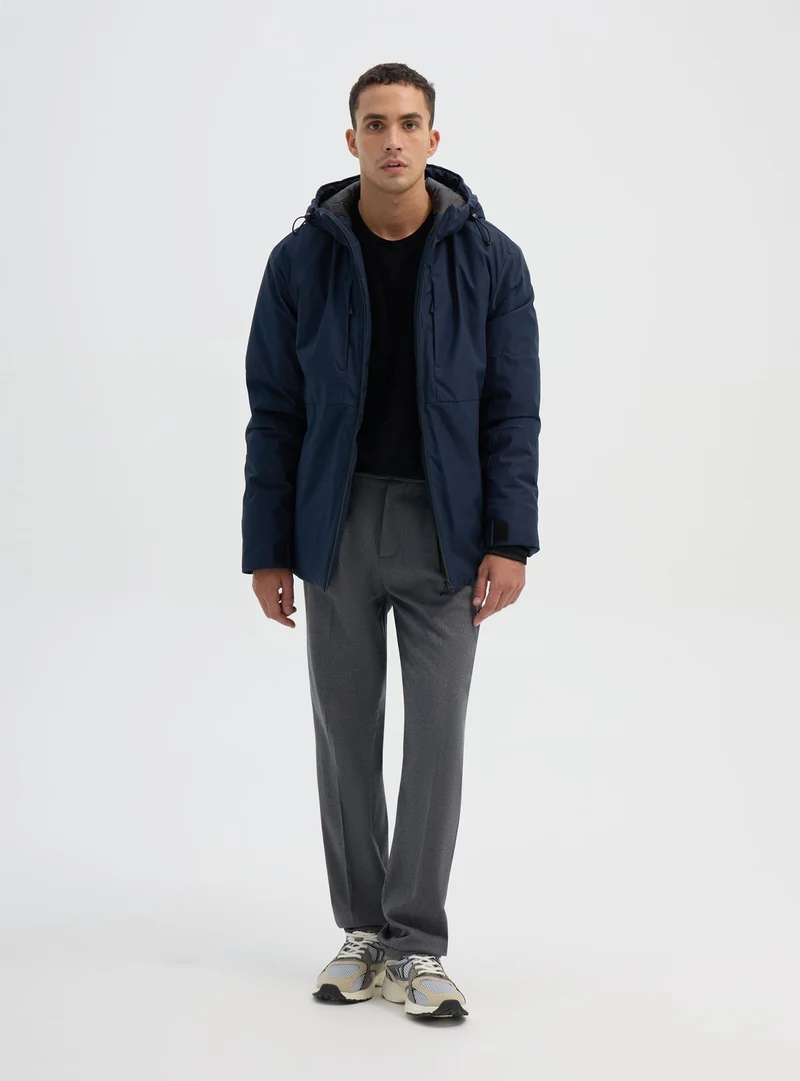 Giacca tecnica con cappuccio e zip