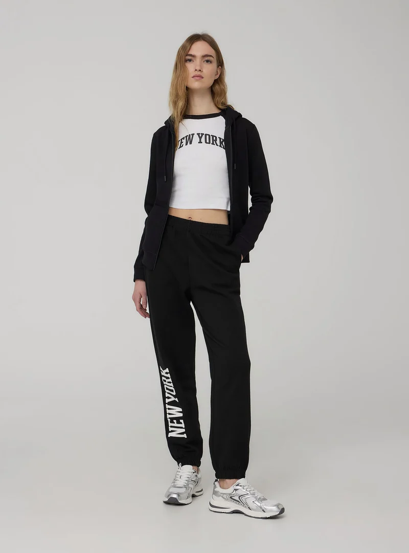 Pantaloni tuta leggeri a vita alta con scritta