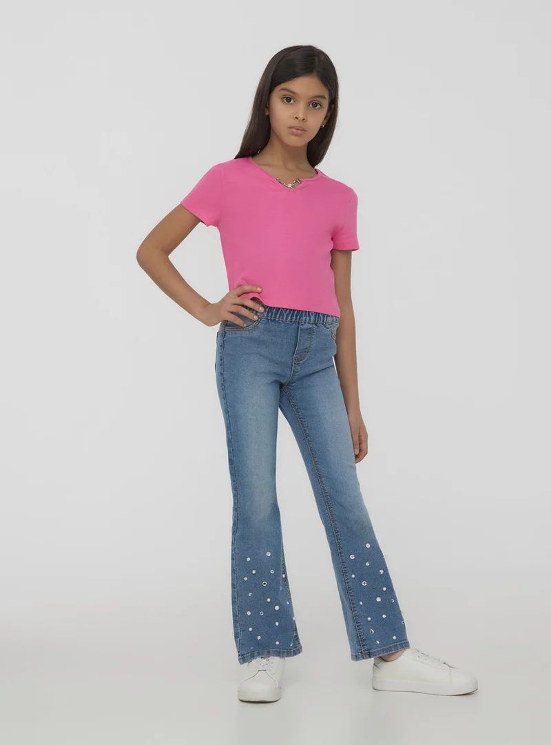 Jeggings a zampa con strass e perle