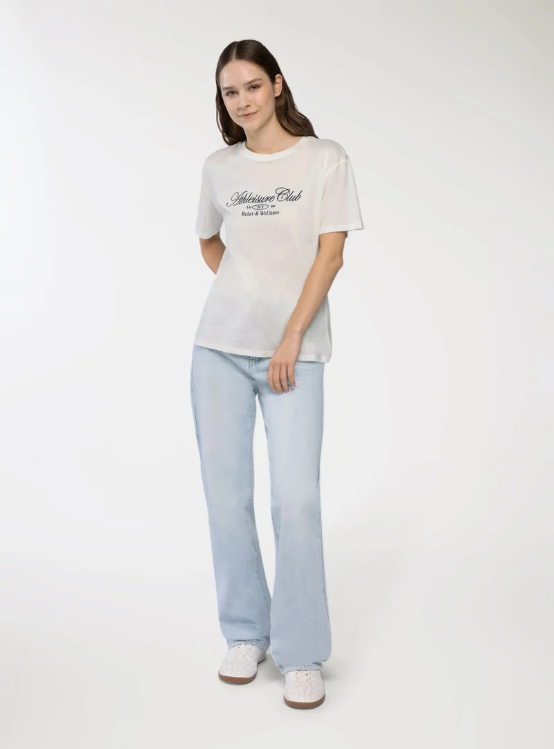 T-shirt ampia con scritta