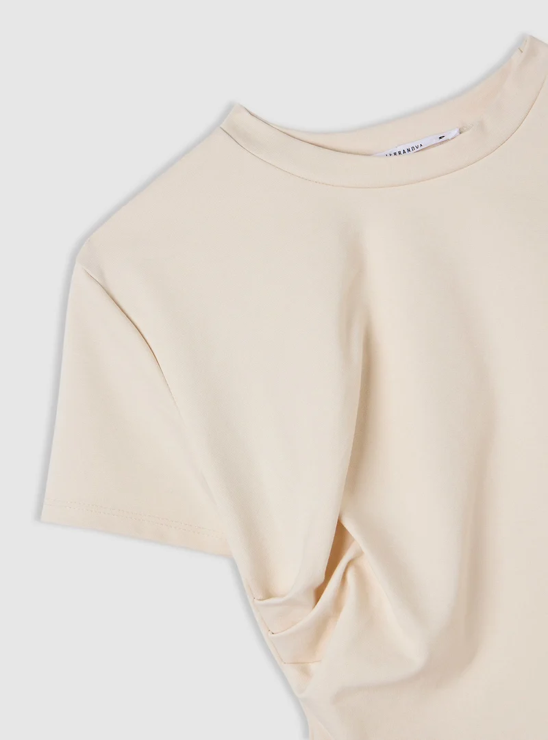T-shirt con drappeggio asimmetrico
