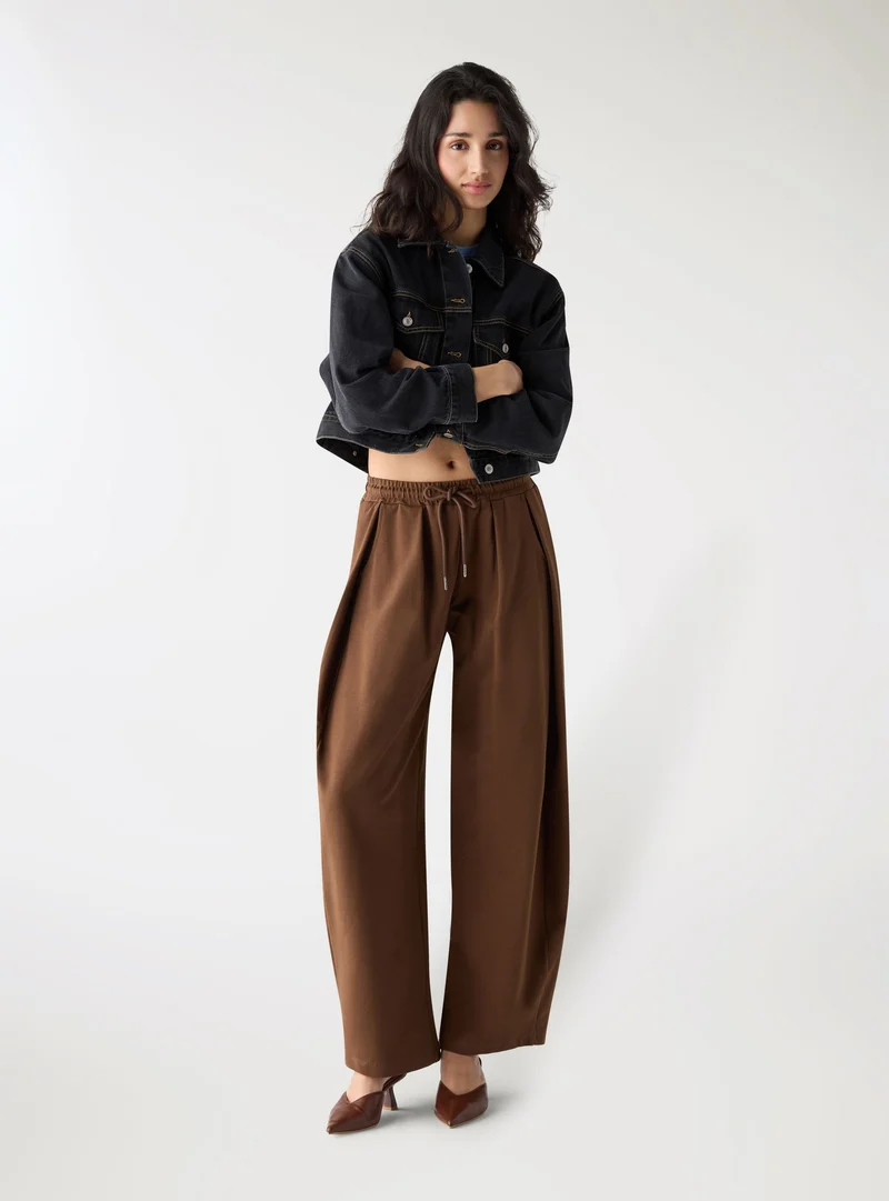 Pantaloni tuta wide leg taglio ampio con coulisse