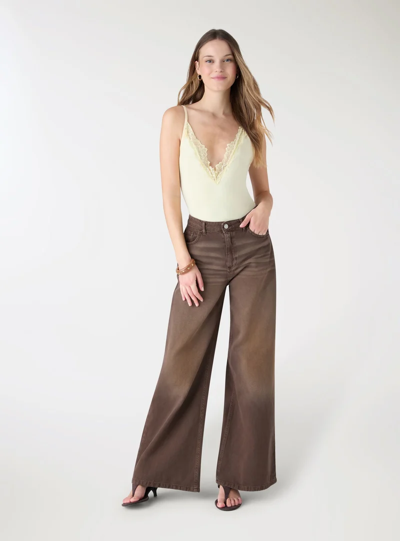 Jeans maxi wide leg a tinta unita