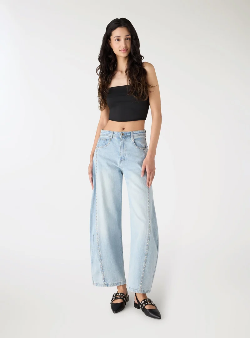 Jeans balloon con borchie