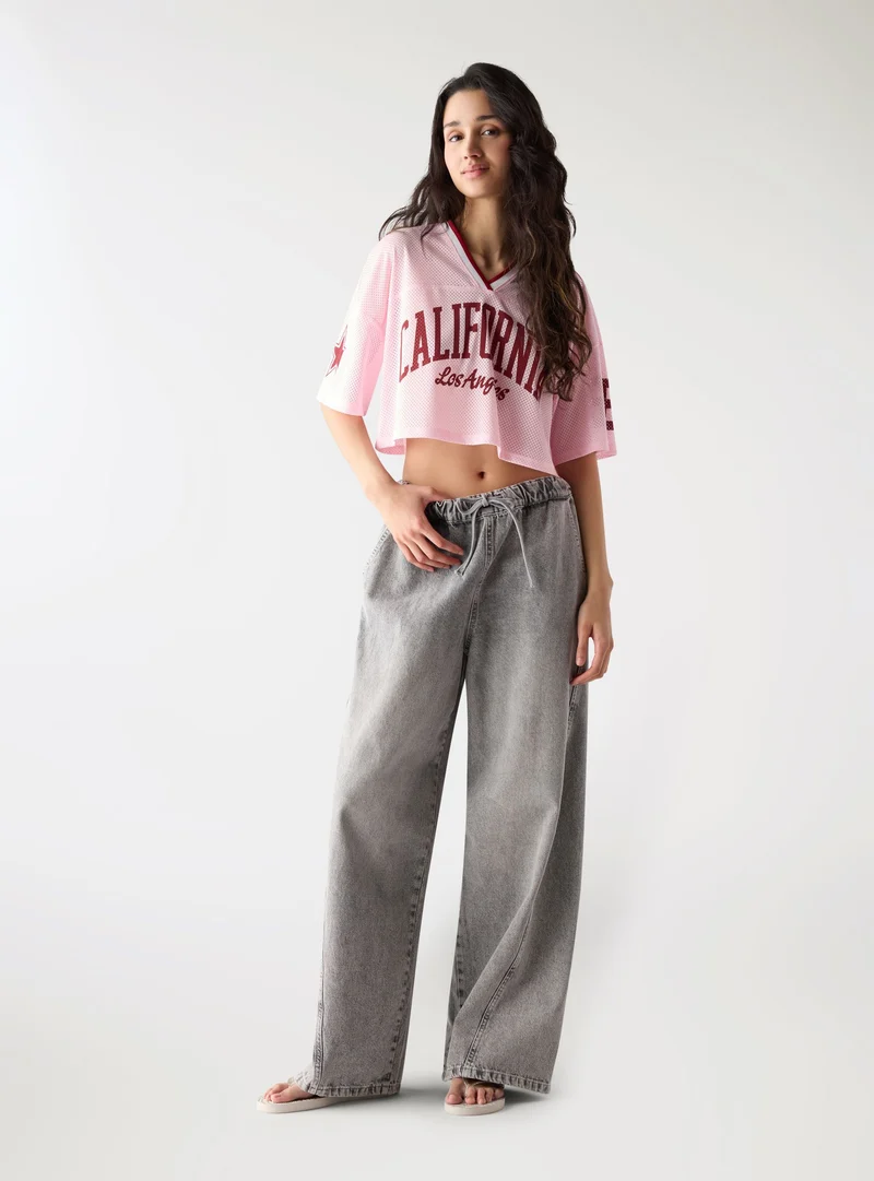 Jeans super wide leg con coulisse in vita