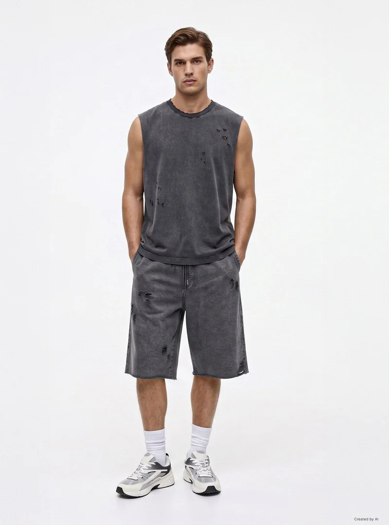 Pantaloni tuta baggy con strappi e coulisse