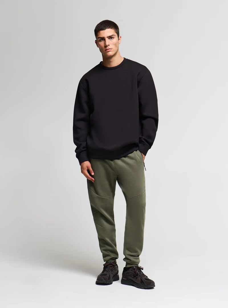 Pantaloni tuta con zip e coulisse