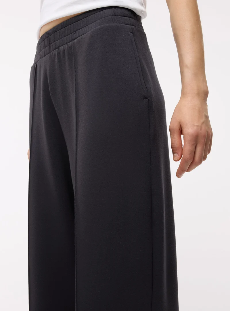 Pantaloni tuta wide leg a tinta unita