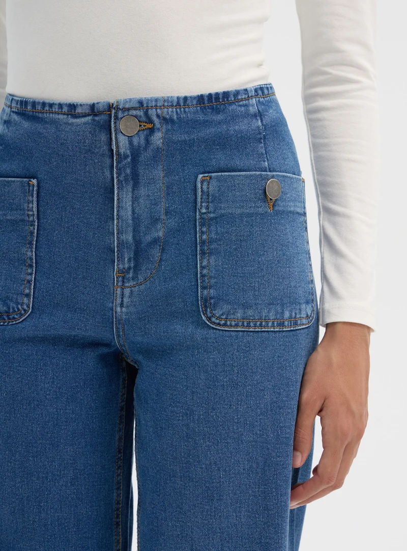 Jeans wide leg con tasche a toppa