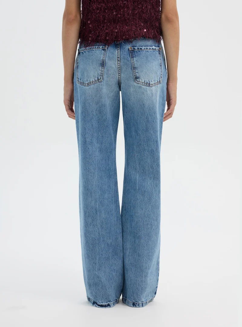 Jeans bootcut a vita media