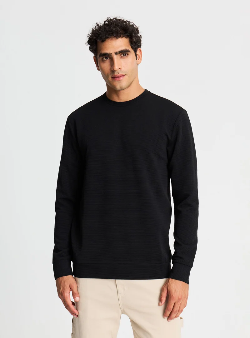 T-shirt manica lunga girocollo a tinta unita