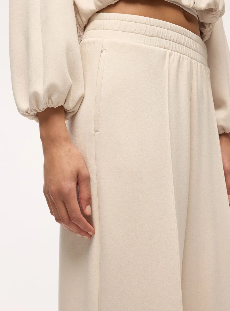 Pantaloni tuta wide leg a tinta unita