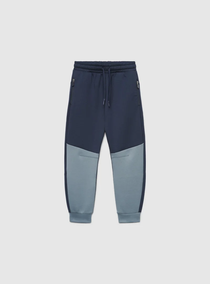 Pantaloni tuta jogger con zip e coulisse