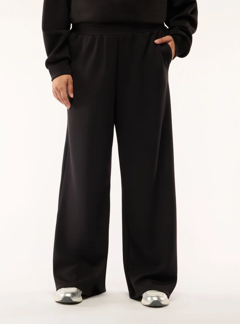Pantaloni tuta wide leg a tinta unita