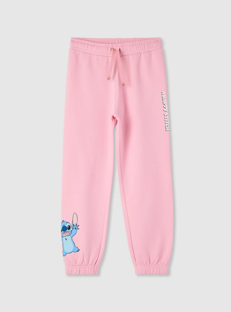 Pantaloni tuta lunghi con stampa Stitch®