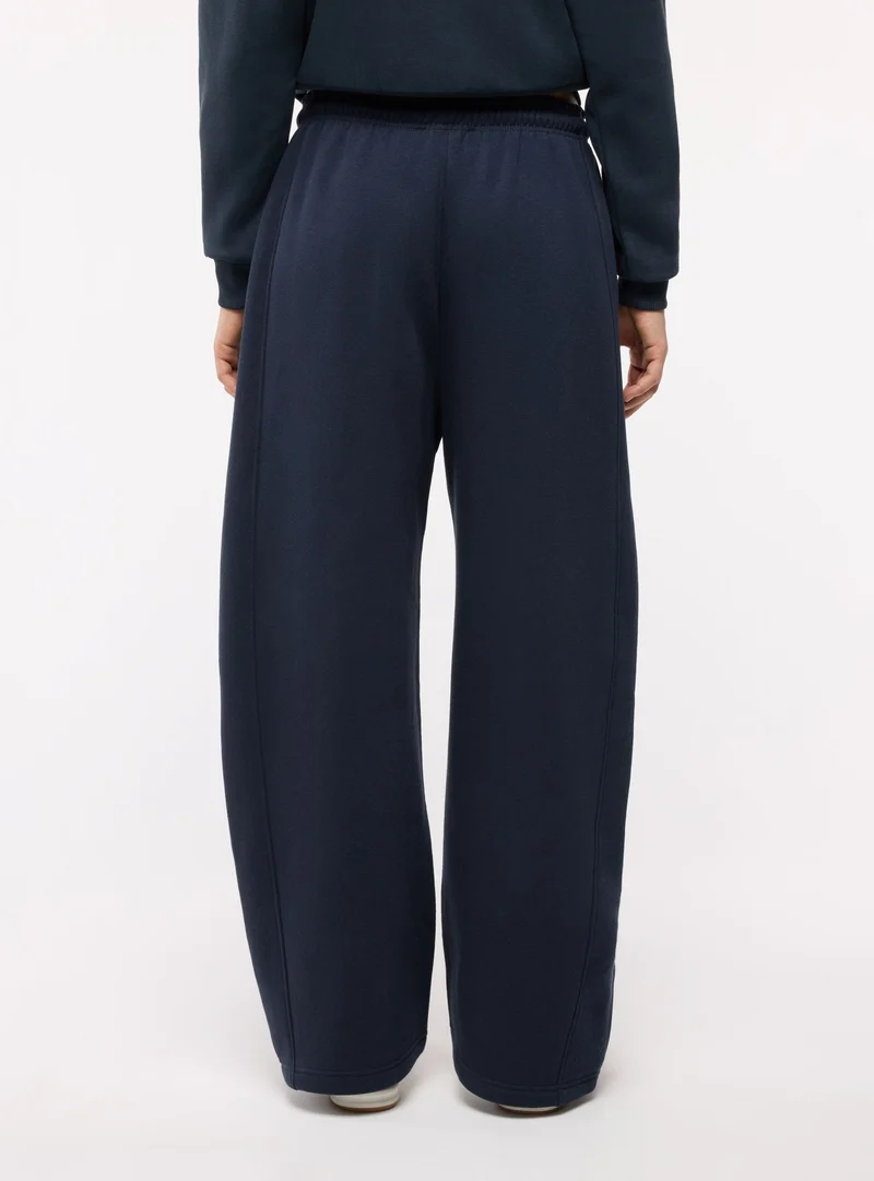 Pantaloni tuta lunghi tinta unita