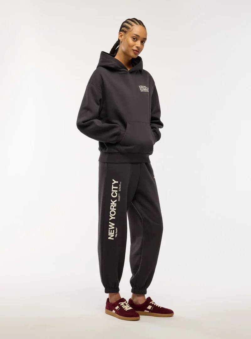 Pantaloni tuta con coulisse e scritta