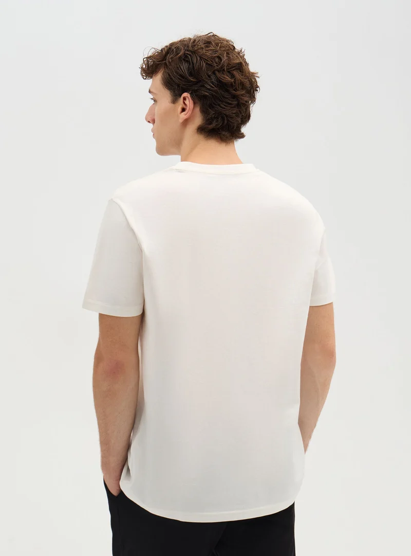 T-shirt con stampa lettering