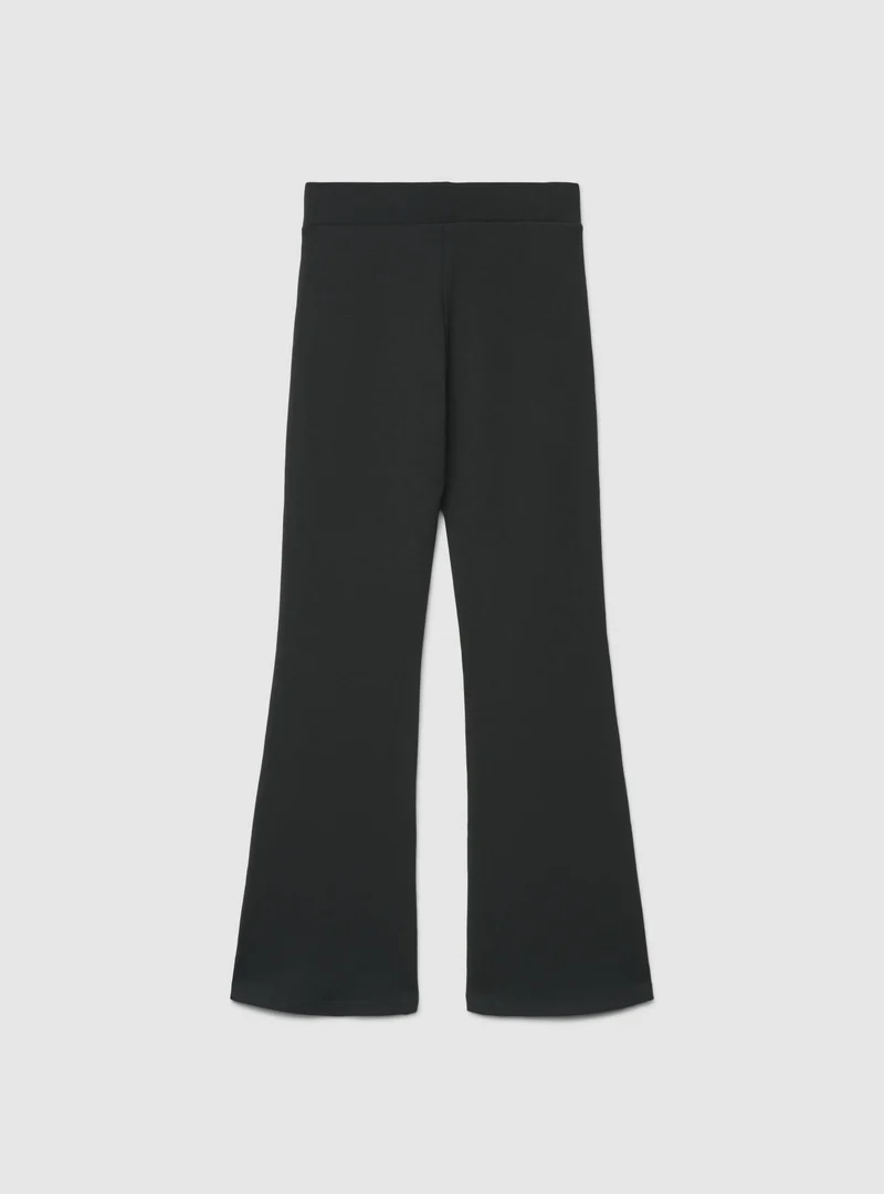 Leggings lunghi a zampa tinta unita