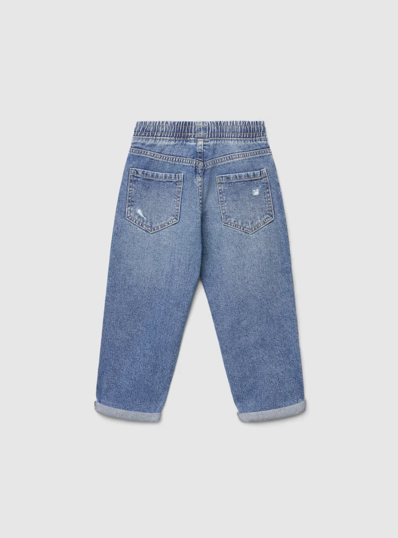 Jeans jogger con strappi