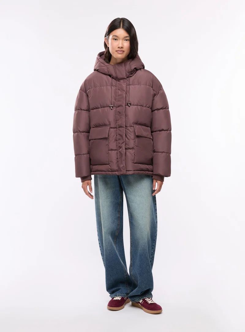 Giubbotto imbottito oversize con cappuccio