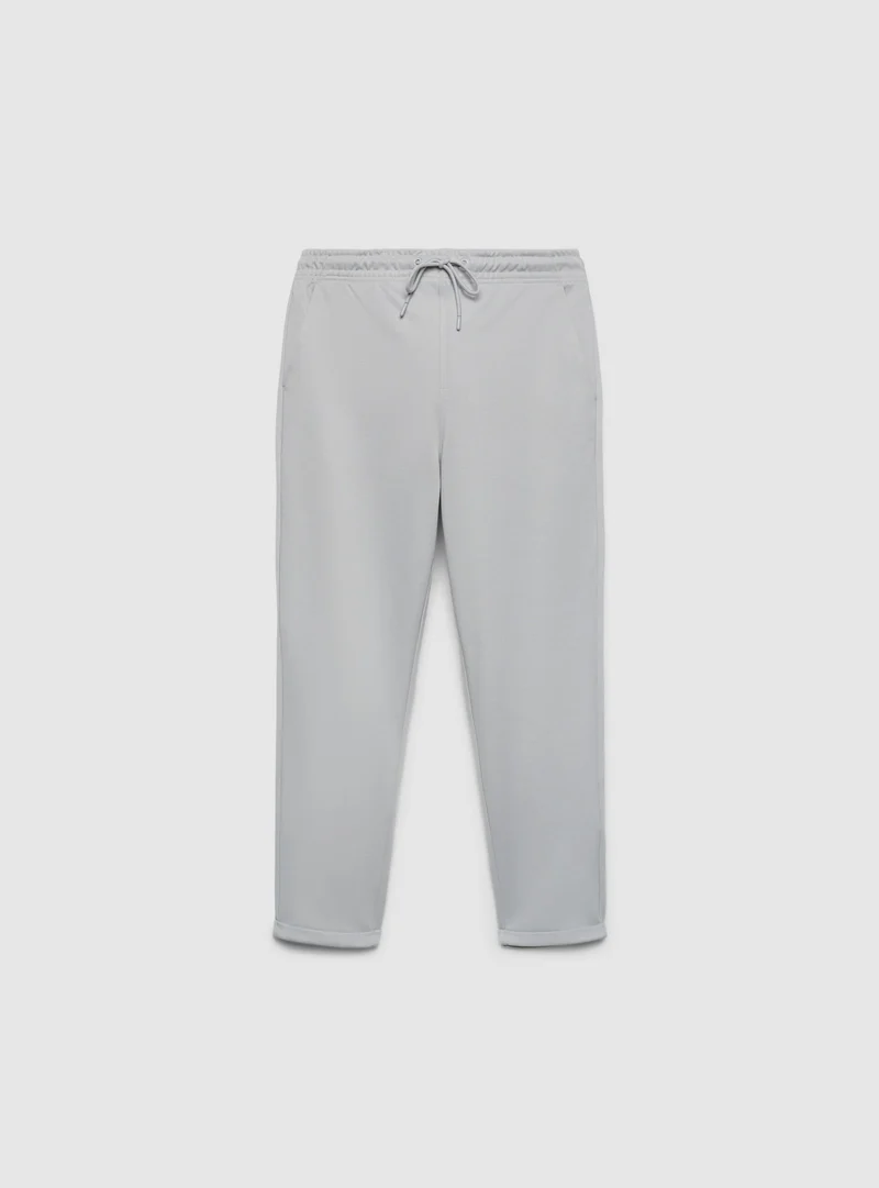 Pantaloni tuta lunghi in piquet con risvolto