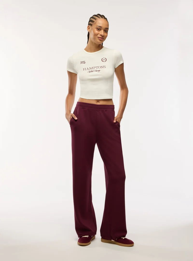 T-shirt crop con stampa college