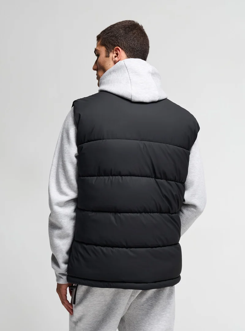 Gilet imbottito puffy con collo alto