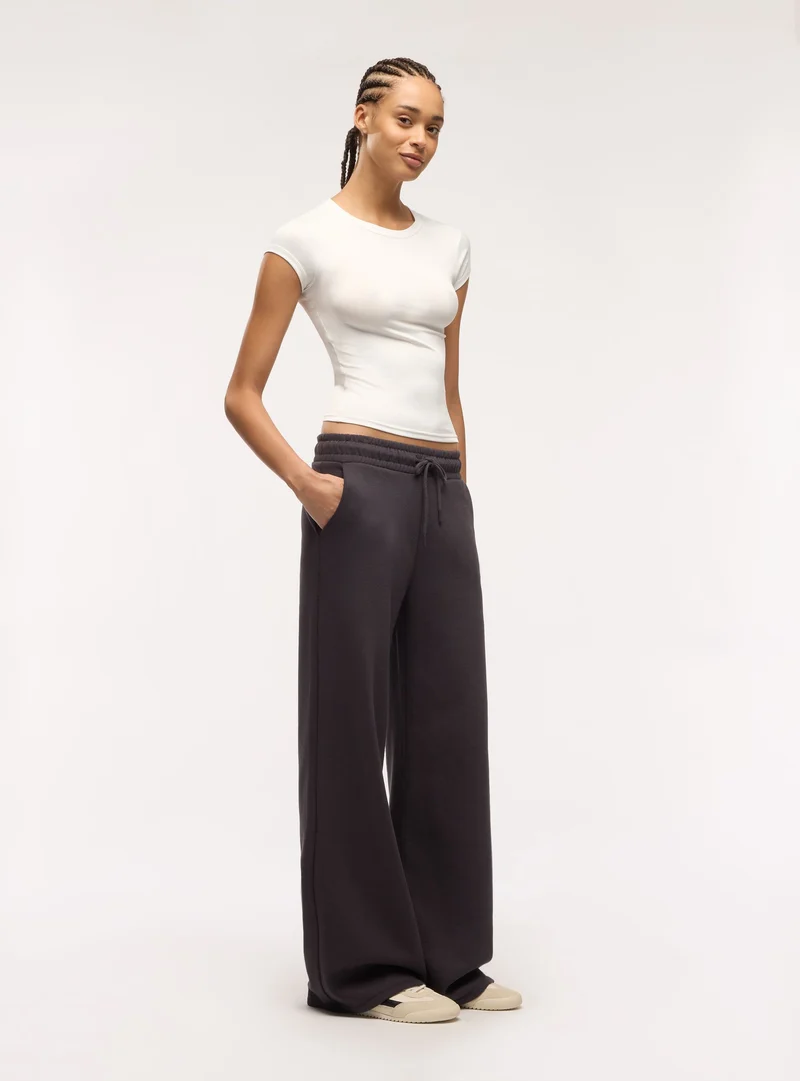 Pantaloni tuta maxi con coulisse a tinta unita