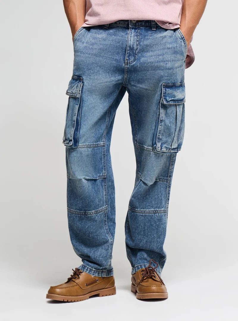 Jeans cargo over a tinta unita