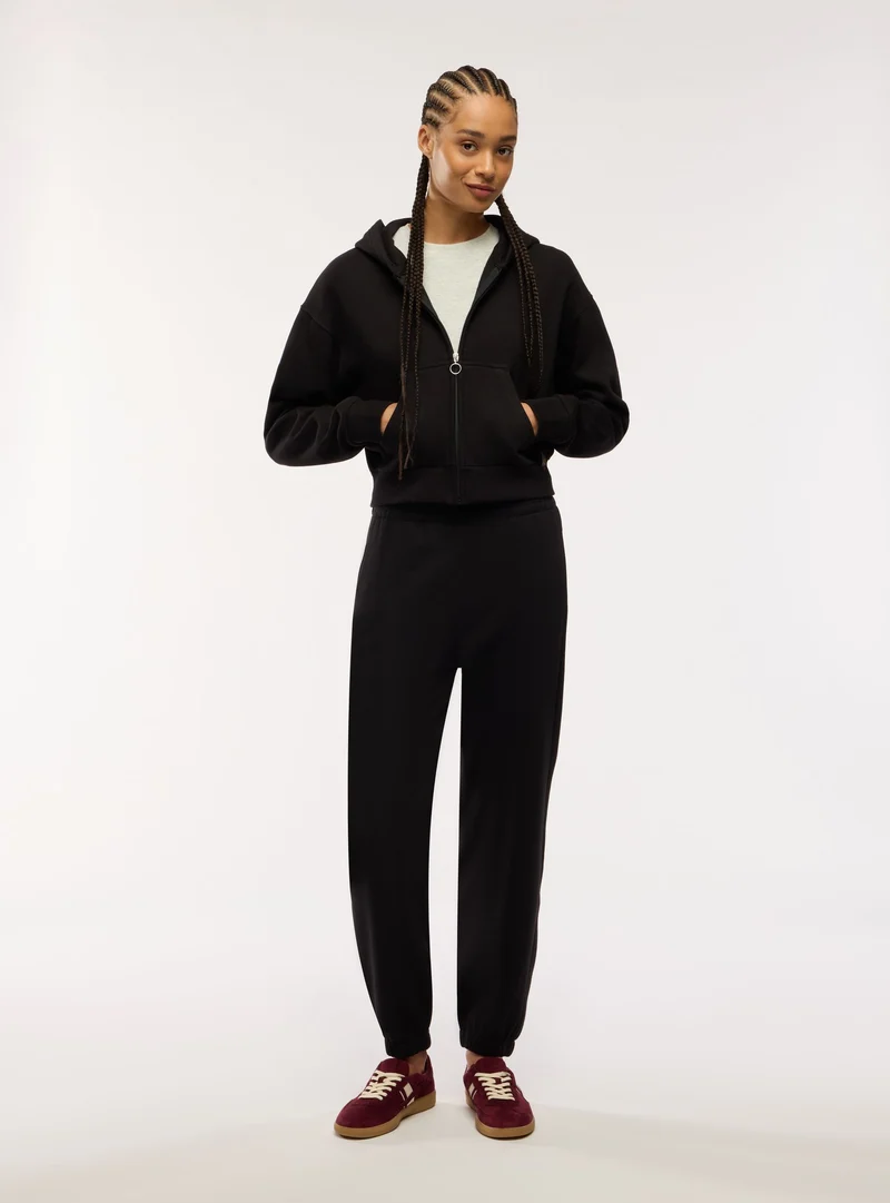 Pantaloni tuta lunghi con elastico