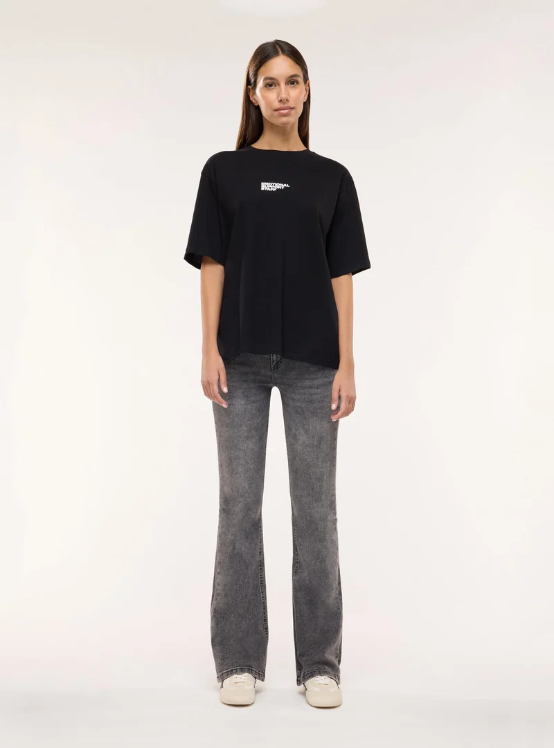 T-shirt ampia con stampa orsetto e scritta
