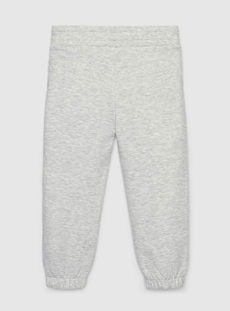 Pantaloni tuta lunghi con elastico e polsini