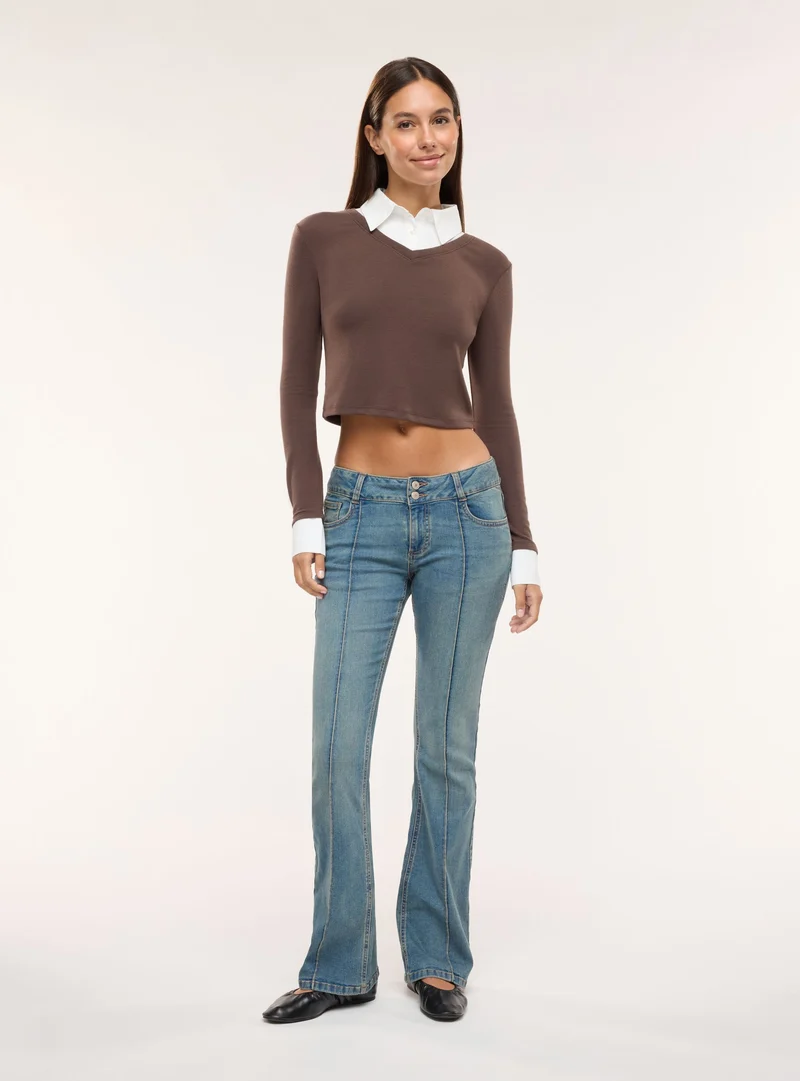 Jeans bootcut a vita bassa tinta unita