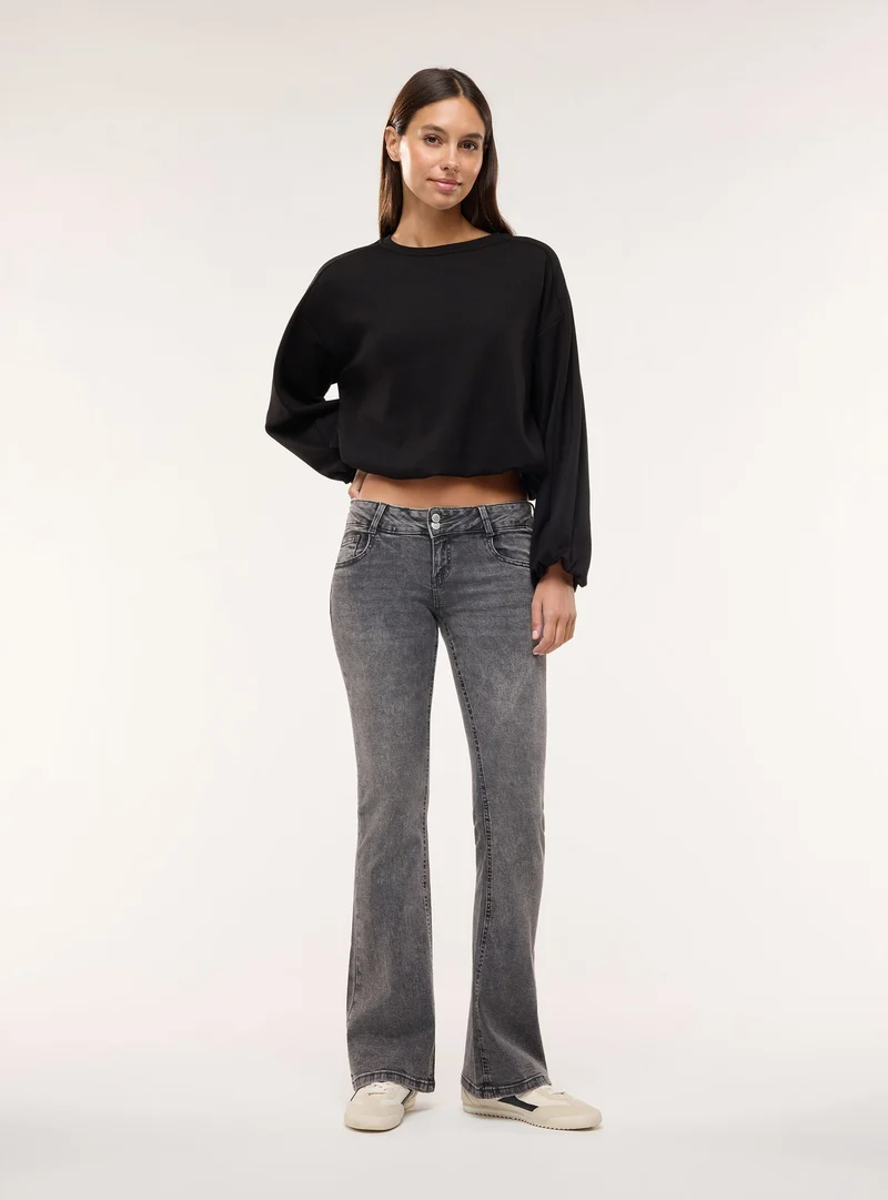 Jeans zampa a vita ultra bassa