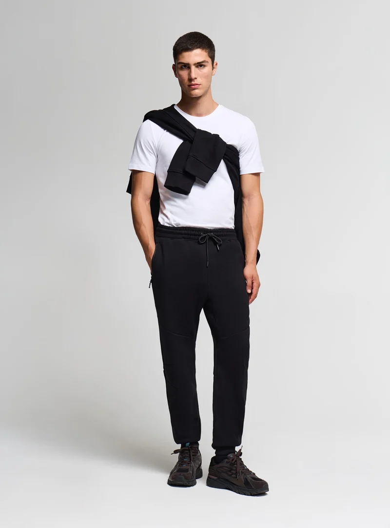 Pantaloni tuta con zip e coulisse