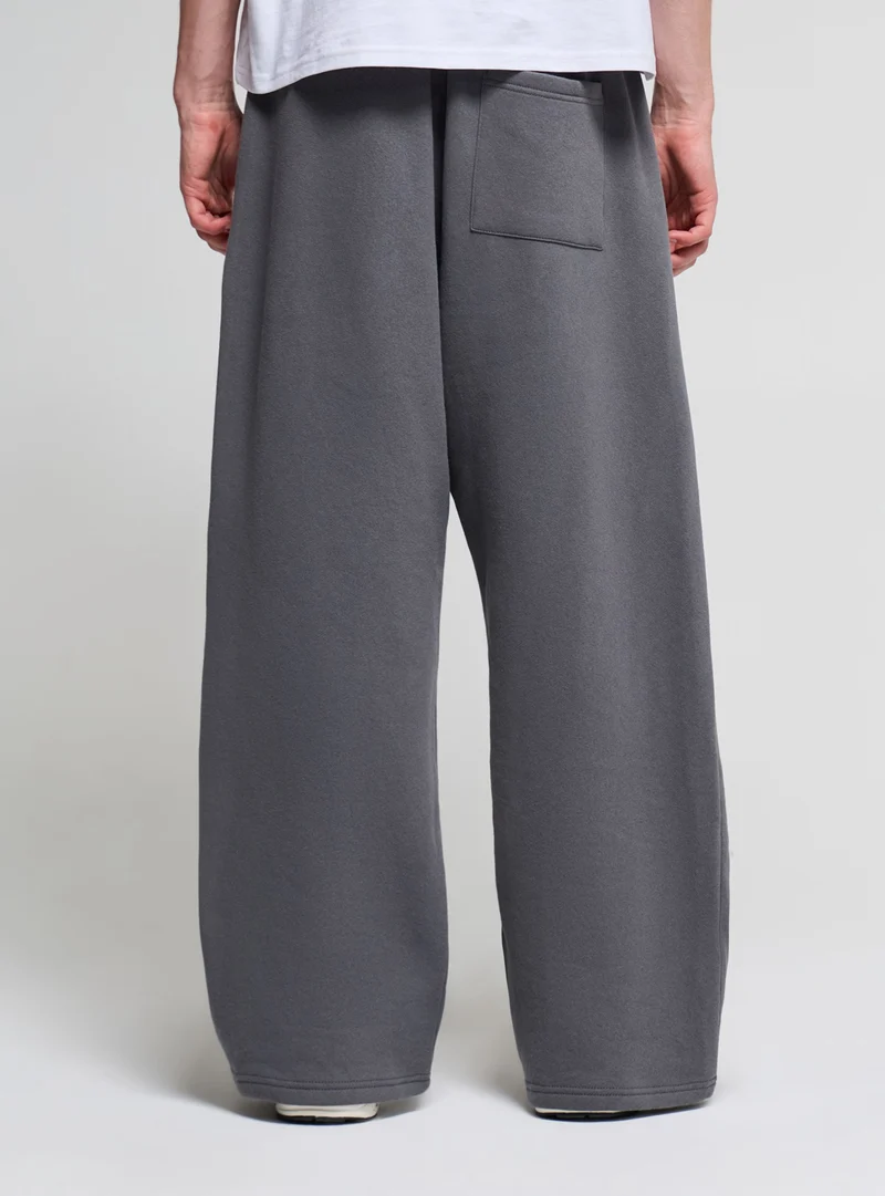 Pantaloni tuta super baggy a tinta unita