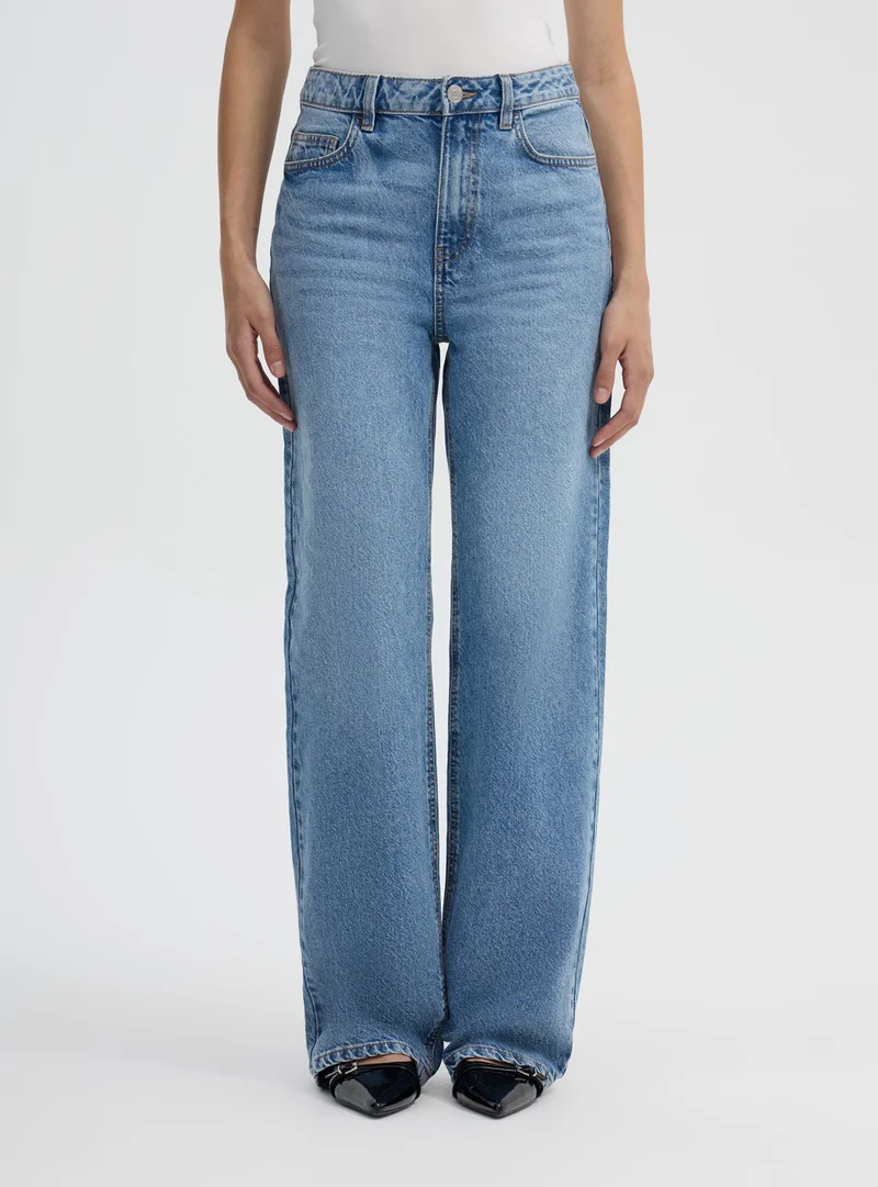 Jeans wide leg a tinta unita