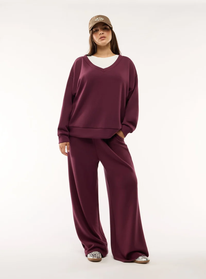 Pantaloni tuta wide leg a tinta unita