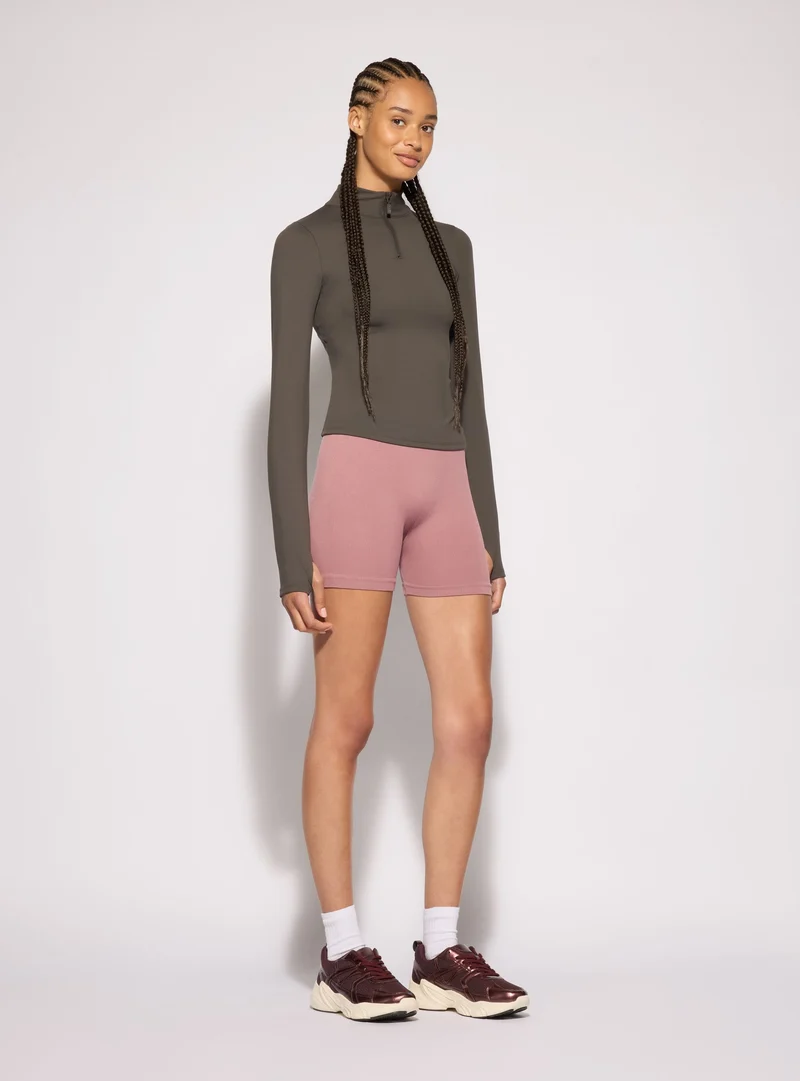 T-shirt sportiva con mezza zip