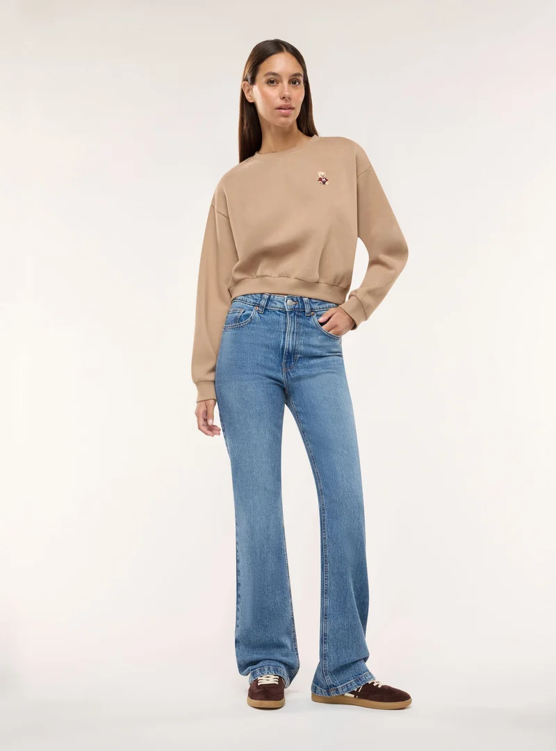 Jeans bootcut a vita media