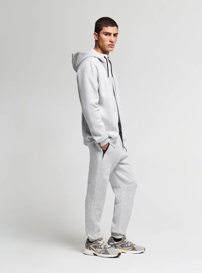 Pantaloni tuta con zip e coulisse