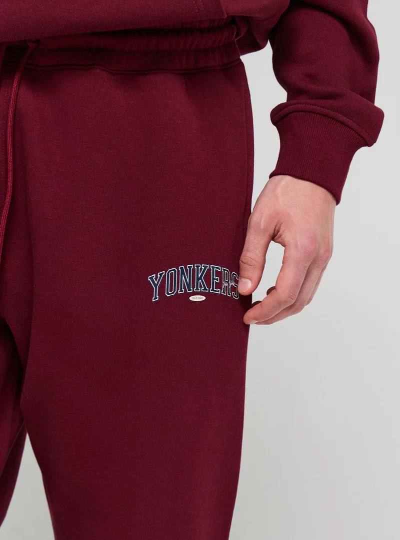 Pantaloni tuta jogger con stampa college