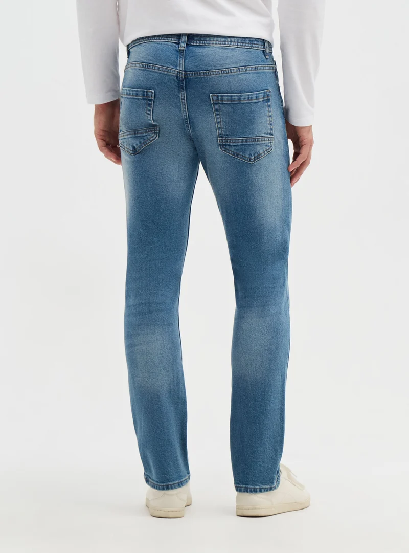 Jeans regular a tinta unita