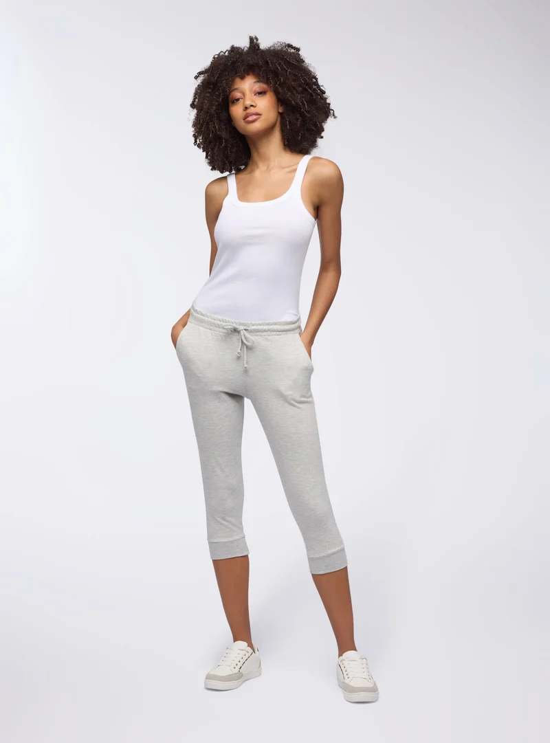 Pantaloni tuta pinocchietto con coulisse