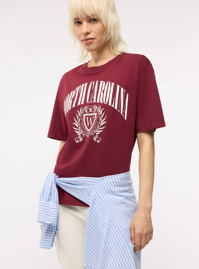 T-shirt maxi con stampa college