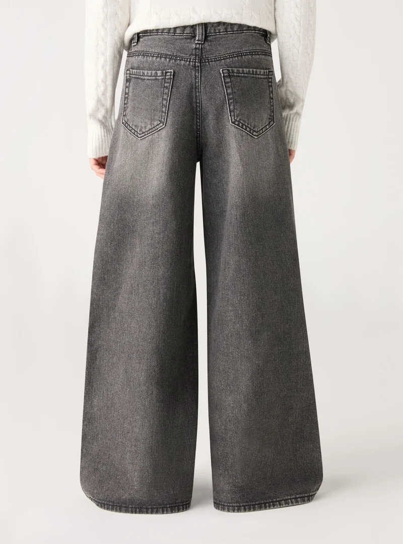 Jeans wide leg con patch orsetto