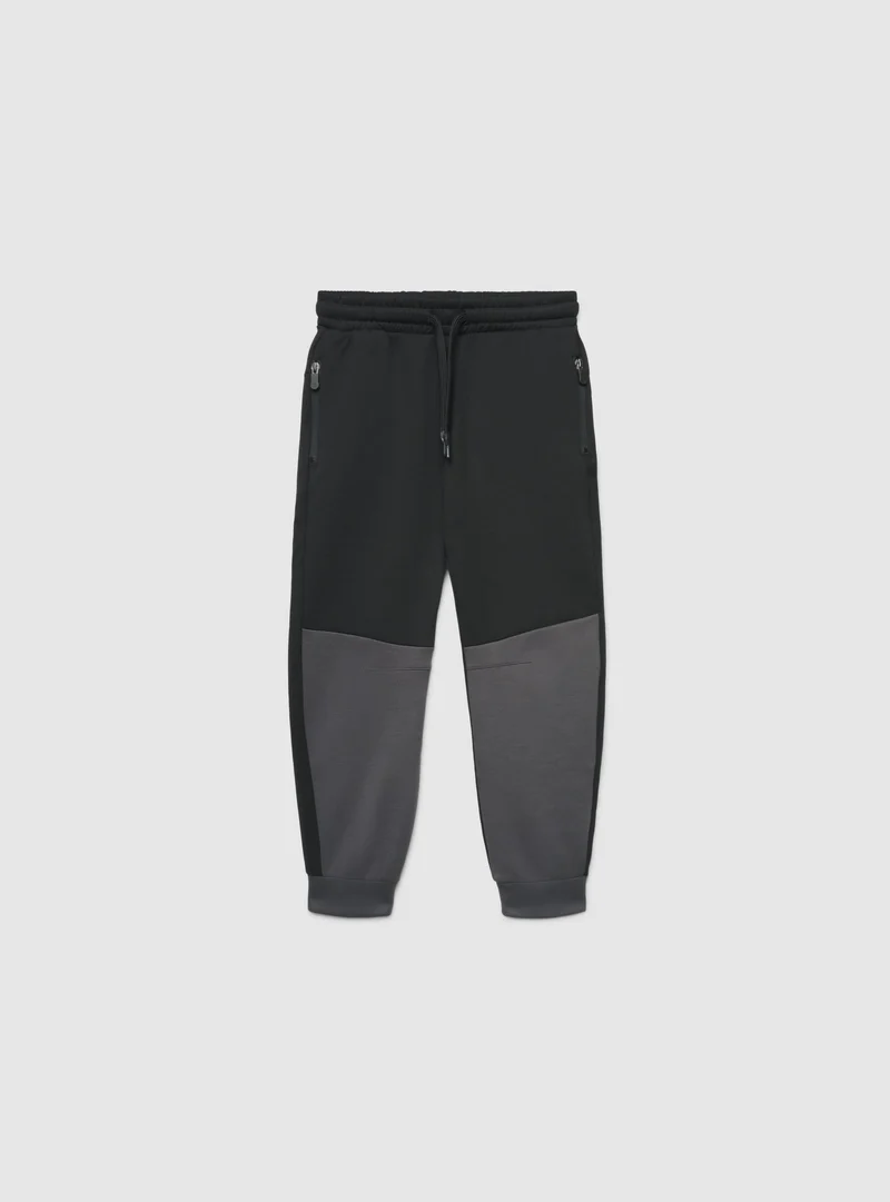 Pantaloni tuta jogger con zip e coulisse